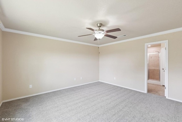 carpeted empty room featuring a ceiling fan, baseboards, visible vents, and ornamental molding