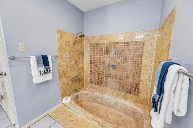 bathroom featuring tile patterned flooring, bathtub / shower combination, and a textured ceiling