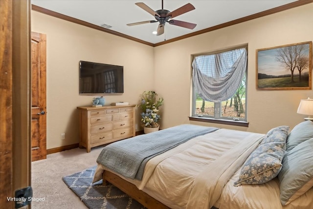 bedroom with carpet floors, a ceiling fan, baseboards, visible vents, and ornamental molding