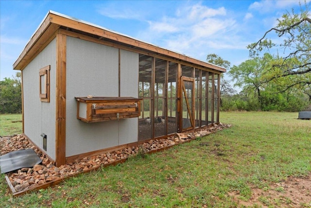 view of poultry coop with a lawn