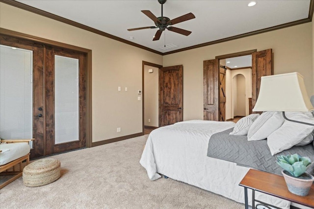 carpeted bedroom with french doors, visible vents, crown molding, baseboards, and recessed lighting