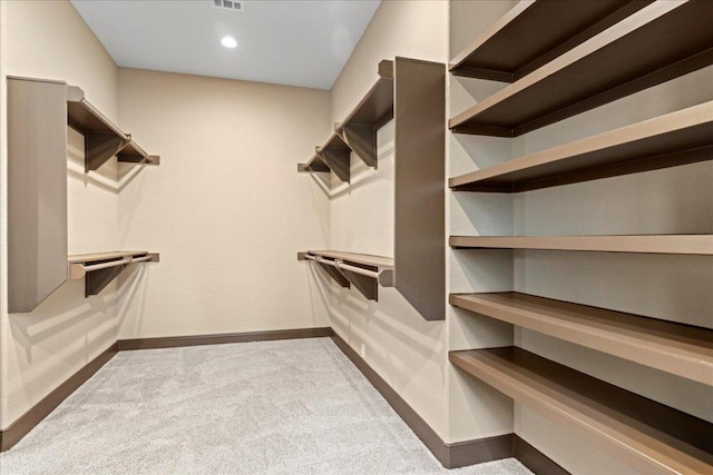walk in closet with carpet floors and visible vents