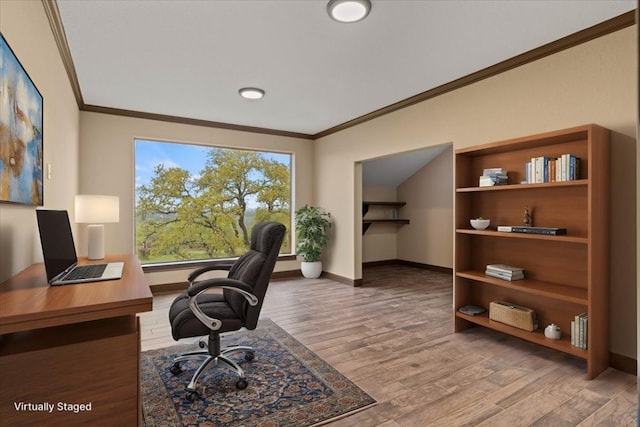 office featuring crown molding, baseboards, and wood finished floors