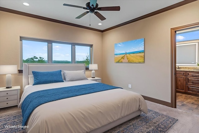 carpeted bedroom featuring recessed lighting, baseboards, ornamental molding, and a ceiling fan