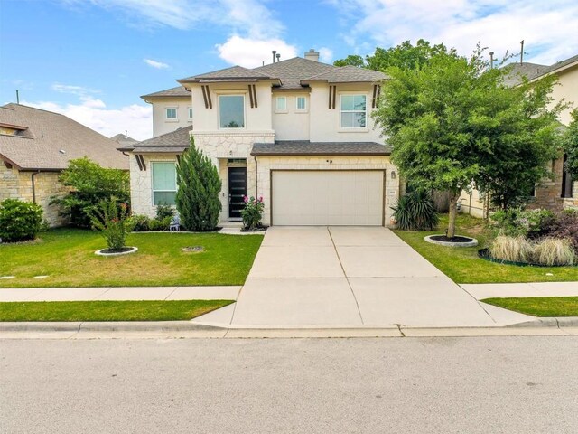 view of front of house with a front yard, stone siding, stucco siding, concrete driveway, and an attached garage