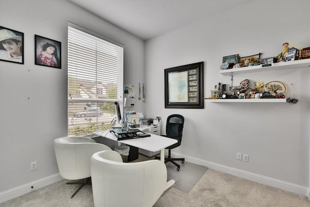 carpeted office featuring baseboards