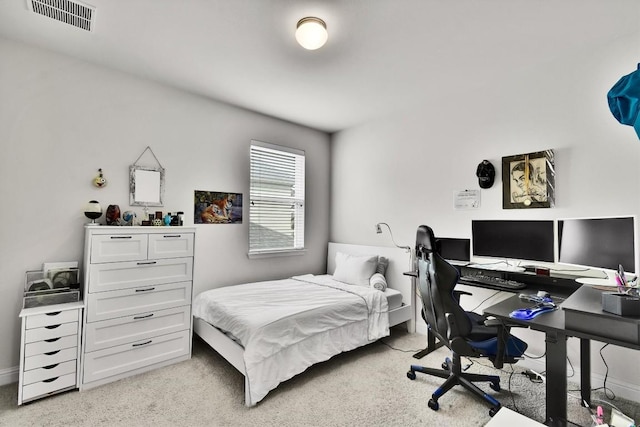 bedroom featuring baseboards, light colored carpet, and visible vents