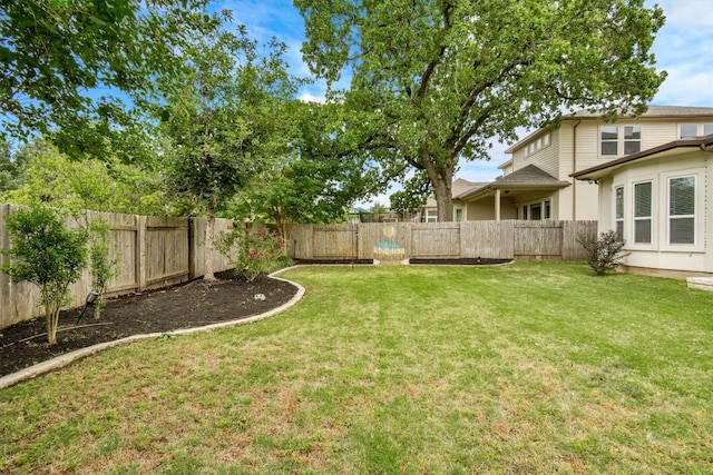 view of yard with a fenced backyard