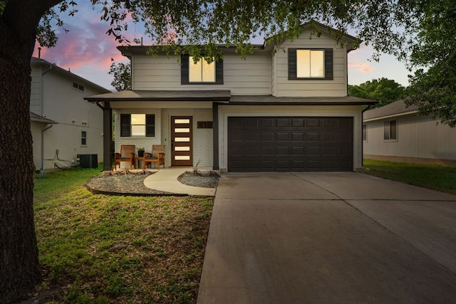 815 Sheraton Ave, Austin, TX 78745 - traditional-style house with an attached garage, concrete driveway, brick siding, a porch, and a front lawn
