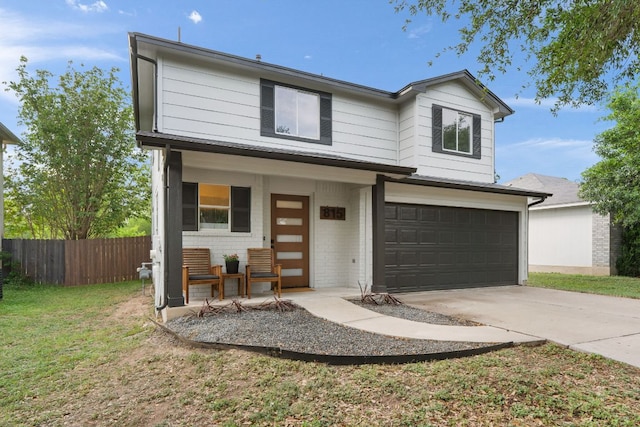 815 Sheraton Ave, Austin, TX 78745 - traditional-style home featuring covered porch, an attached garage, driveway, and brick siding