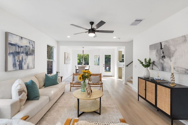 815 Sheraton Ave, Austin, TX 78745 - living room with light wood-style flooring, stairs, a ceiling fan, recessed lighting, and baseboards
