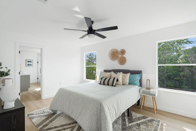815 Sheraton Ave, Austin, TX 78745 - bedroom featuring light wood-style floors, baseboards, and a ceiling fan