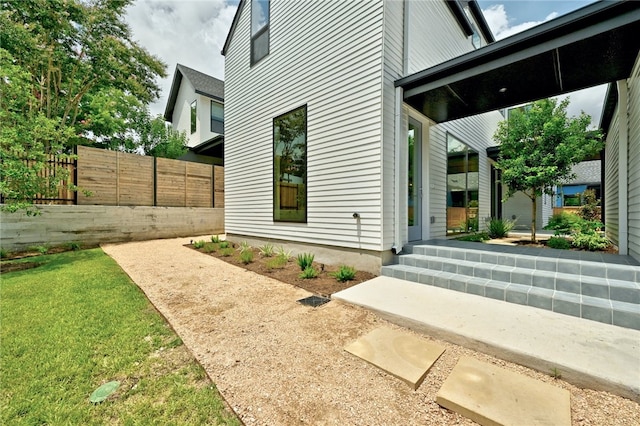 view of side of property with fence