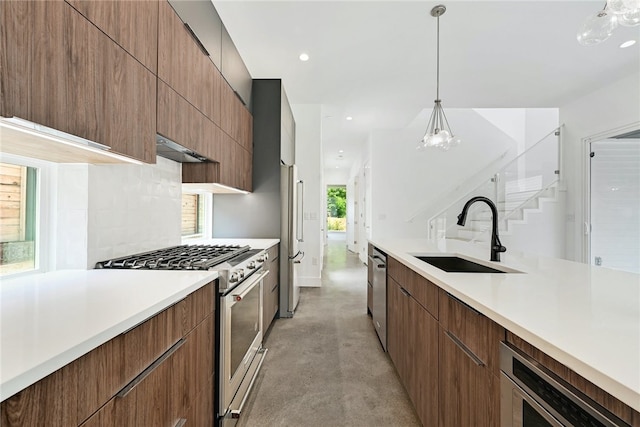 kitchen featuring an inviting chandelier, a sink, light countertops, stainless steel appliances, and modern cabinets