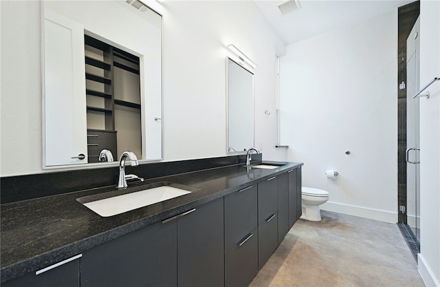 full bath featuring toilet, baseboards, concrete flooring, and a sink