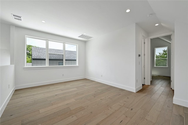 spare room featuring recessed lighting, baseboards, visible vents, and light wood finished floors