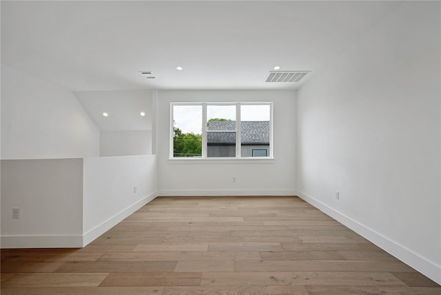 spare room featuring recessed lighting, baseboards, visible vents, and light wood finished floors