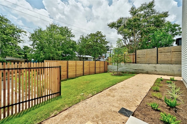view of yard with a fenced backyard
