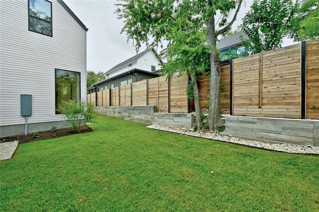 view of yard with a fenced backyard