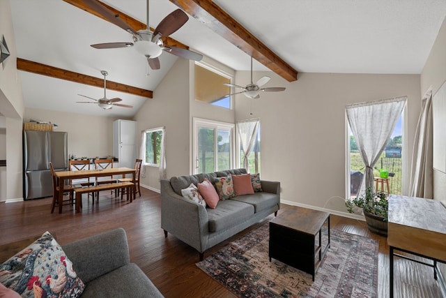 living area featuring vaulted ceiling with beams, baseboards, ceiling fan, and wood finished floors