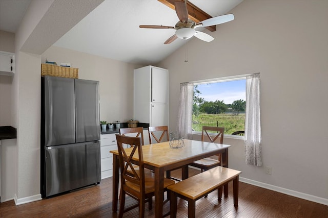 dining room featuring baseboards, dark wood-style flooring, ceiling fan, and high vaulted ceiling