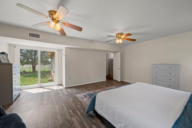 bedroom with access to outside, a ceiling fan, wood finished floors, and visible vents