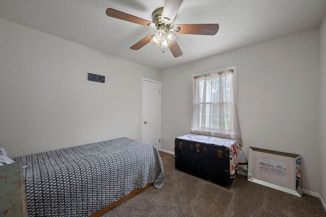 carpeted bedroom featuring baseboards and ceiling fan