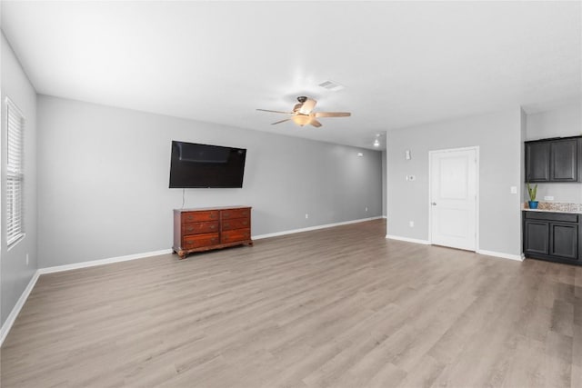 509 Peony Ct, Jarrell, TX 76537 - unfurnished living room featuring baseboards, a ceiling fan, light wood-type flooring, and visible vents