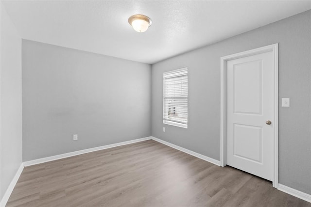 509 Peony Ct, Jarrell, TX 76537 - empty room with baseboards and wood finished floors
