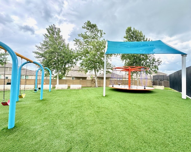 509 Peony Ct, Jarrell, TX 76537 - view of play area featuring a lawn and a fenced backyard