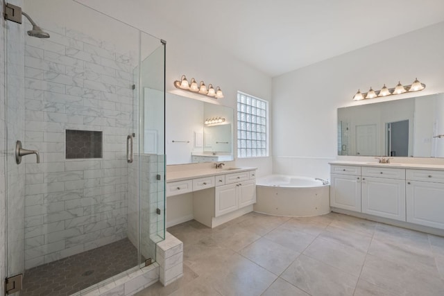 13305 Kinder Pass, Austin, TX 78727 - full bathroom featuring a shower stall, a garden tub, two vanities, and tile patterned flooring