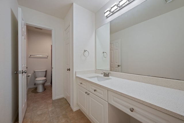 13305 Kinder Pass, Austin, TX 78727 - bathroom with toilet, vanity, baseboards, and tile patterned floors