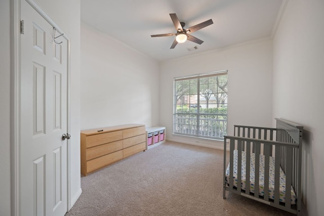13305 Kinder Pass, Austin, TX 78727 - bedroom with carpet, a crib, ornamental molding, and a ceiling fan