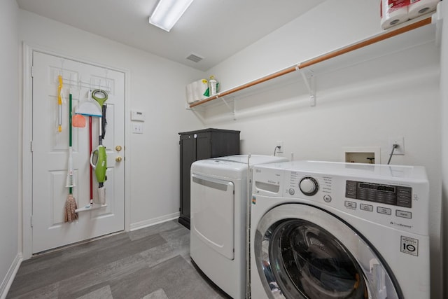 13305 Kinder Pass, Austin, TX 78727 - washroom with washer and clothes dryer, wood finished floors, and baseboards