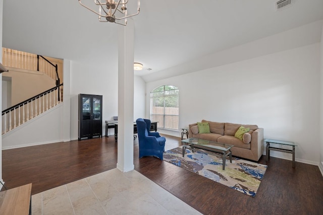 13305 Kinder Pass, Austin, TX 78727 - living area featuring stairway, a chandelier, baseboards, wood finished floors, and high vaulted ceiling