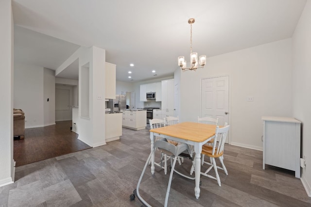 13305 Kinder Pass, Austin, TX 78727 - dining room featuring a chandelier, baseboards, wood finished floors, and recessed lighting