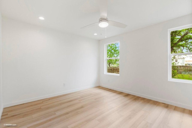 381 Perryman St, New Braunfels, TX 78130 - spare room featuring healthy amount of natural light, light wood finished floors, ceiling fan, baseboards, and recessed lighting