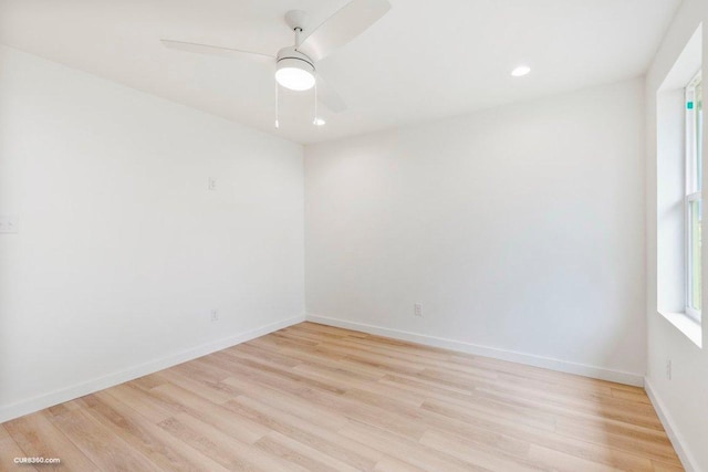 spare room with light wood-type flooring, recessed lighting, baseboards, and ceiling fan
