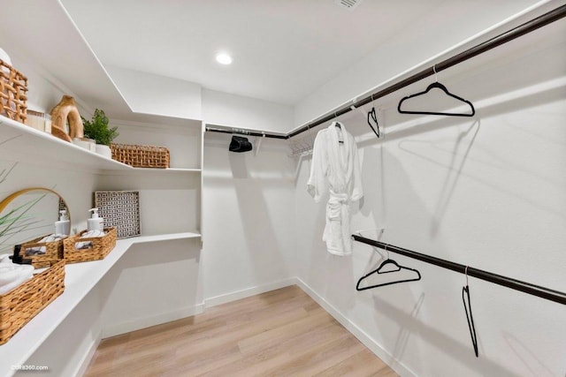 walk in closet featuring light wood-style floors