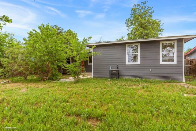 back of house with a yard