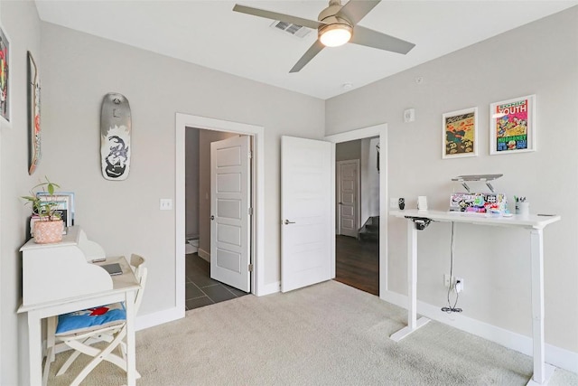interior space featuring visible vents, baseboards, and ceiling fan
