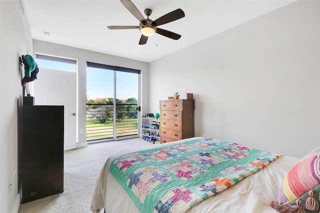 carpeted bedroom with ceiling fan and access to exterior