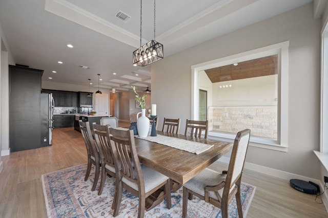 dining space featuring visible vents, ornamental molding, baseboards, recessed lighting, and light wood finished floors
