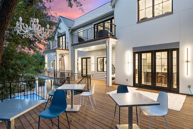4203 Balcones Dr, Austin, TX 78731 - deck at dusk with french doors