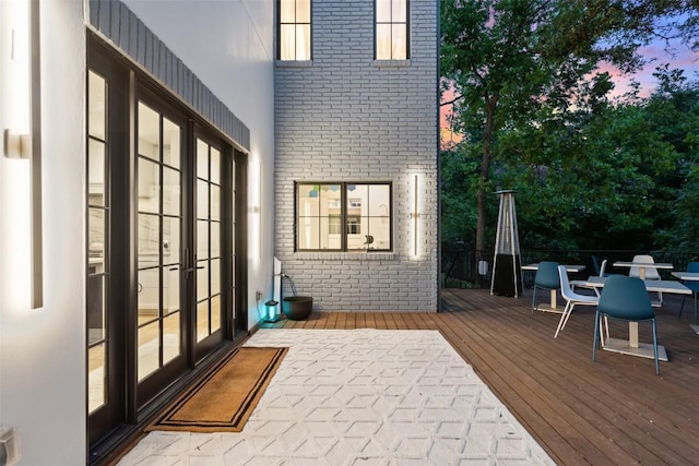 4203 Balcones Dr, Austin, TX 78731 - deck at dusk with french doors