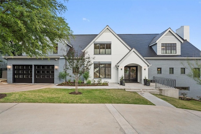 4203 Balcones Dr, Austin, TX 78731 - view of front of home featuring a chimney, french doors, a garage, concrete driveway, and brick siding