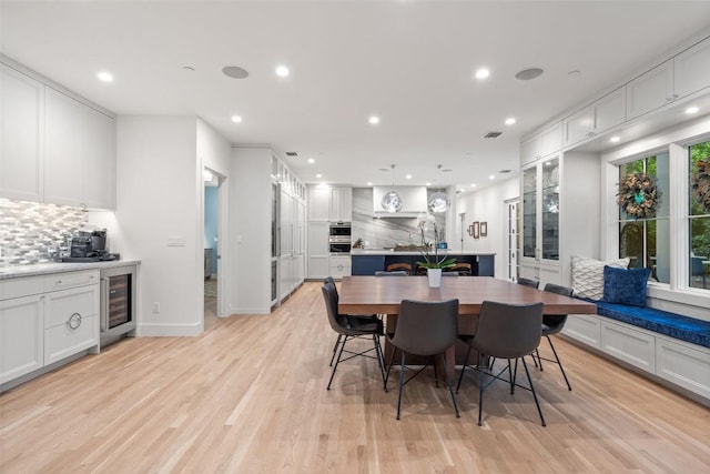 4203 Balcones Dr, Austin, TX 78731 - dining area with beverage cooler, recessed lighting, light wood finished floors, and baseboards