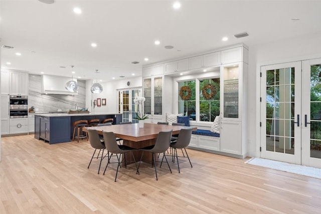 4203 Balcones Dr, Austin, TX 78731 - dining room with french doors, recessed lighting, light wood-type flooring, and healthy amount of natural light