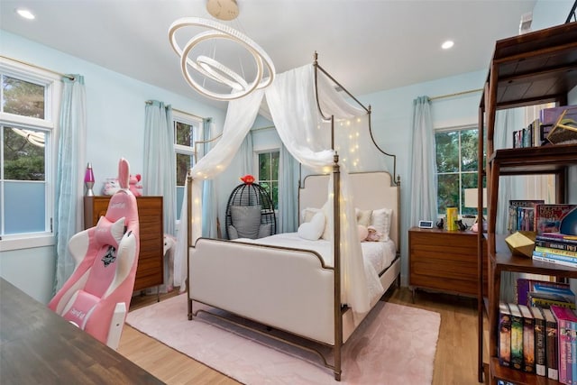 4203 Balcones Dr, Austin, TX 78731 - bedroom featuring wood finished floors, a chandelier, and recessed lighting