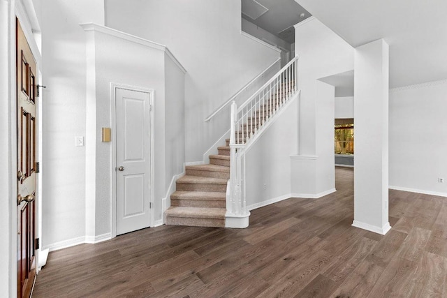 1809 Johnson Way, Round Rock, TX 78681 - foyer entrance featuring wood finished floors, baseboards, a high ceiling, and stairs
